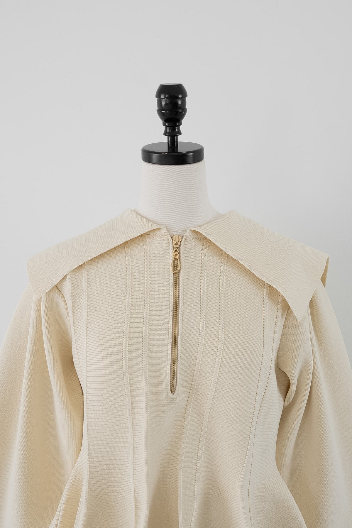 peplum zip knit tops